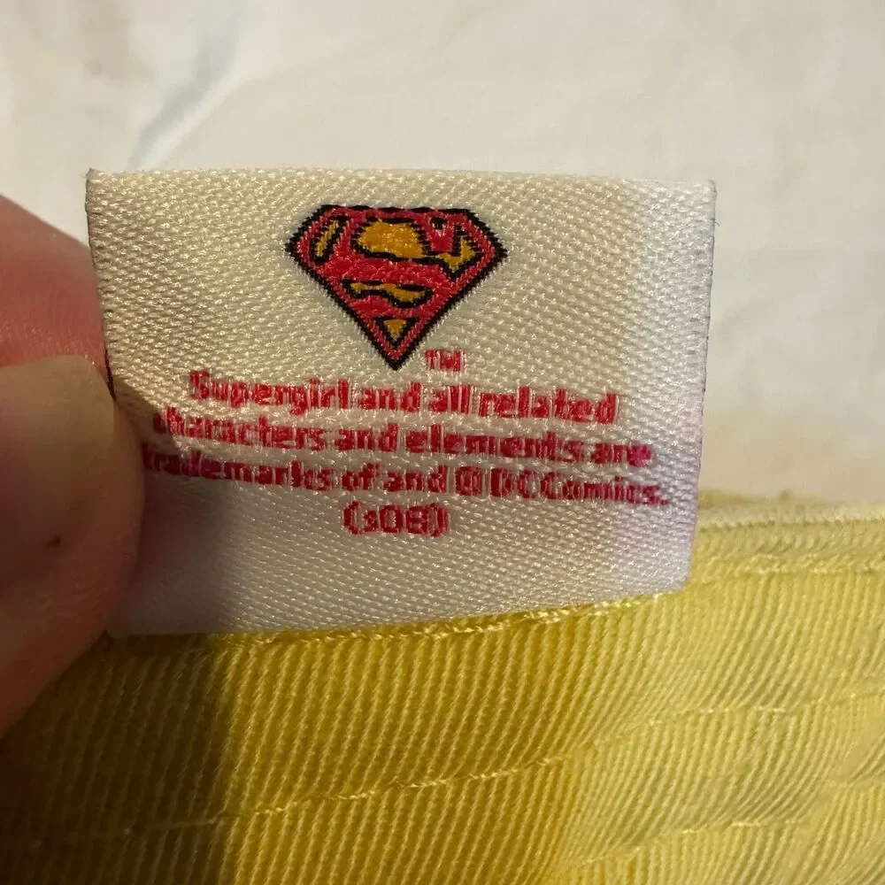 DC Comics Supergirl Hat Yellow Cargo Pocket Anoma Shield Cap AS IS FLAWED Stain